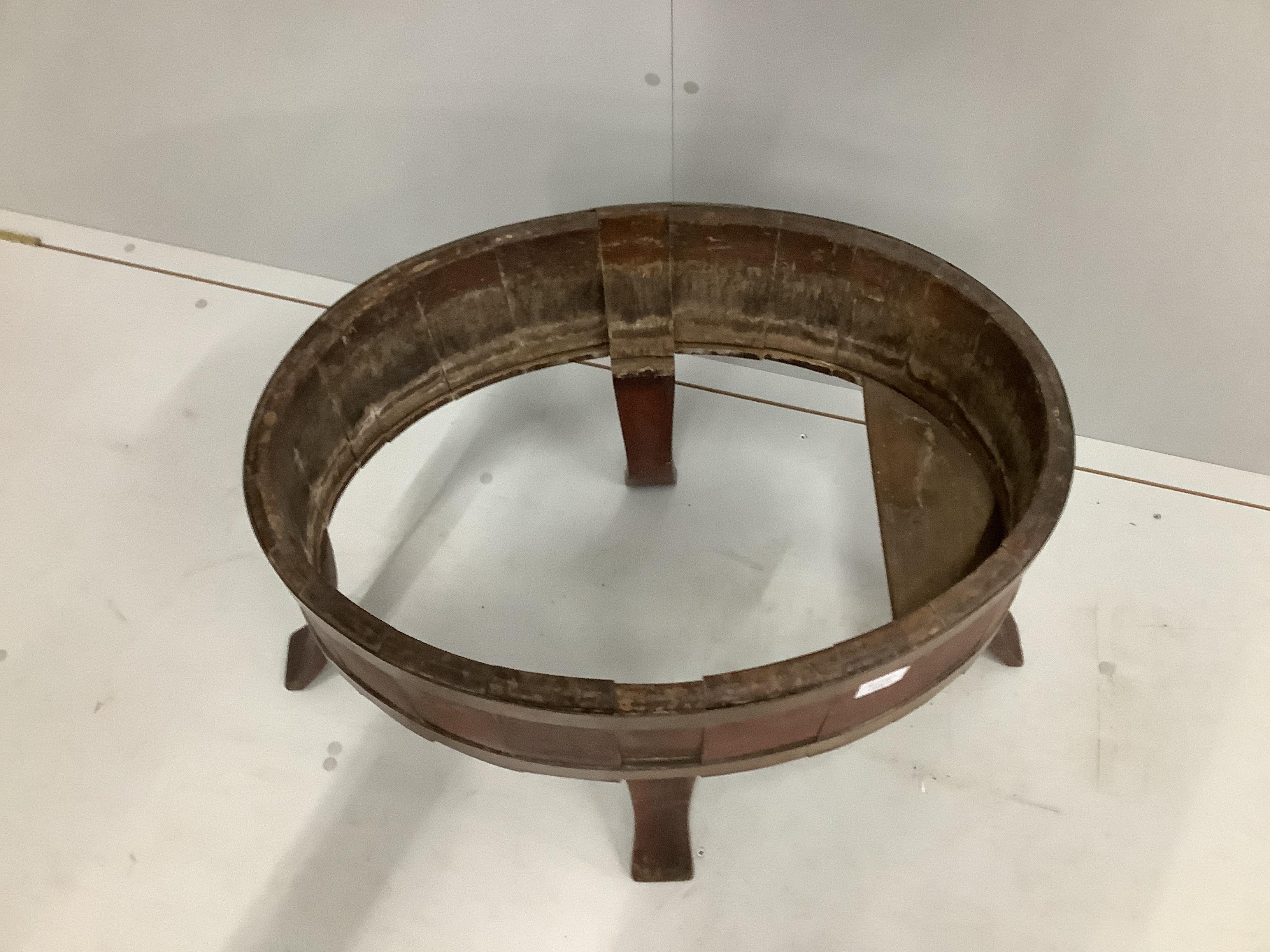 A George III oval brass bound mahogany wine cooler, lacking base and liner, width 75cm, depth 45cm, height 54cm